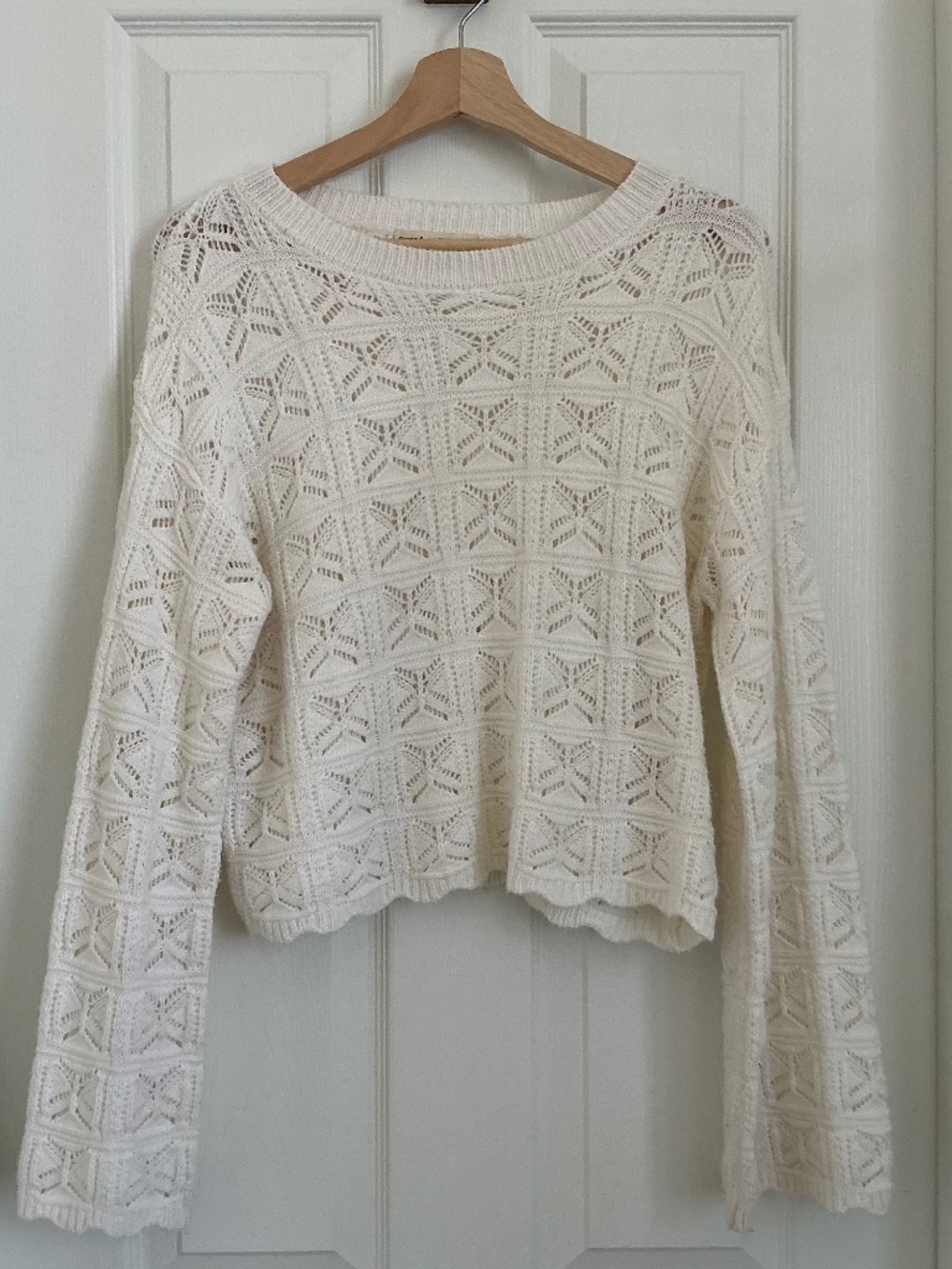 Cream Sweater with scalloped sleeves and bottom